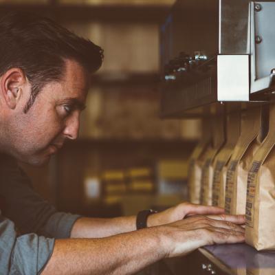 Worker looking at paper-based packaged products