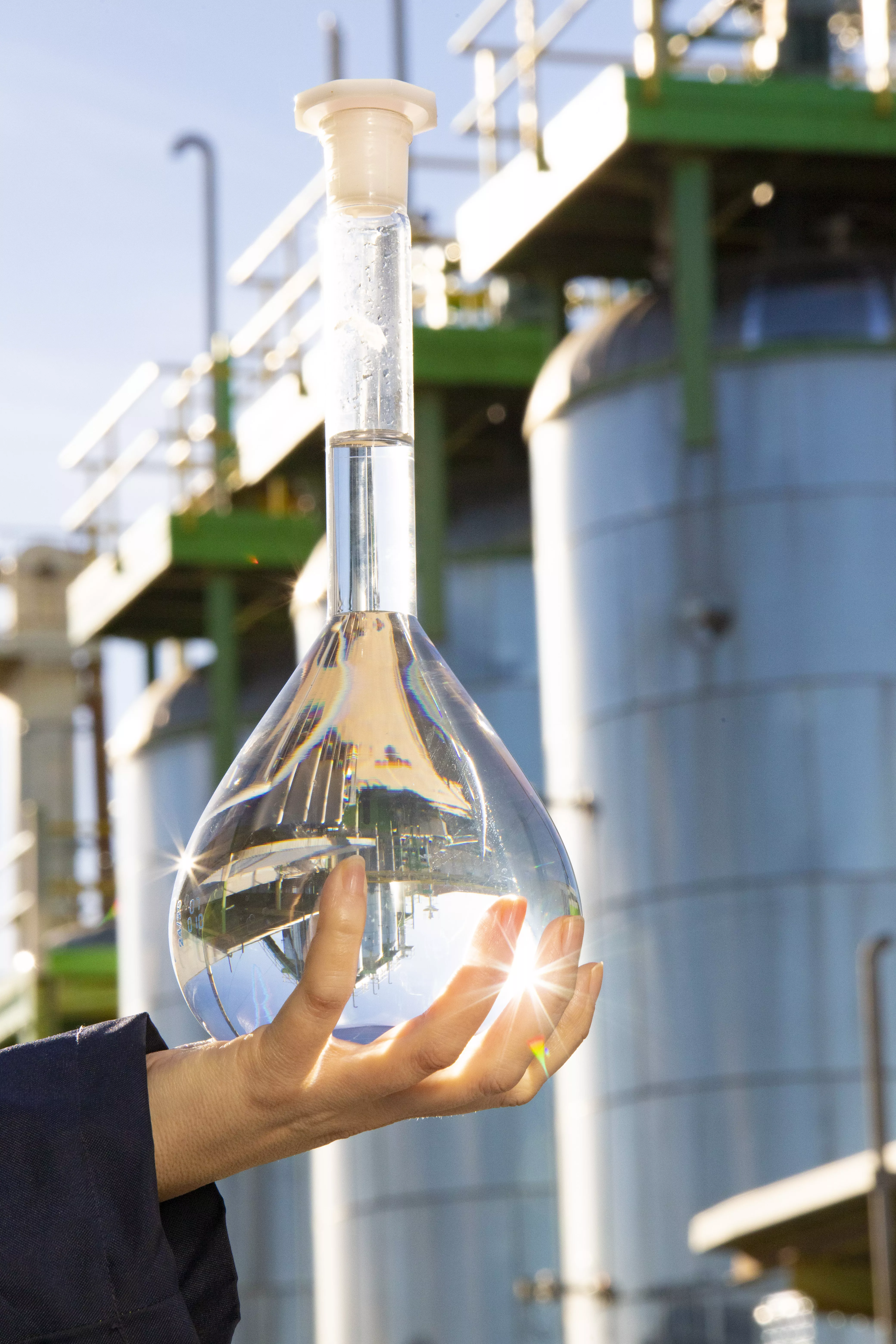 hand holding bioethanol in front of flagship