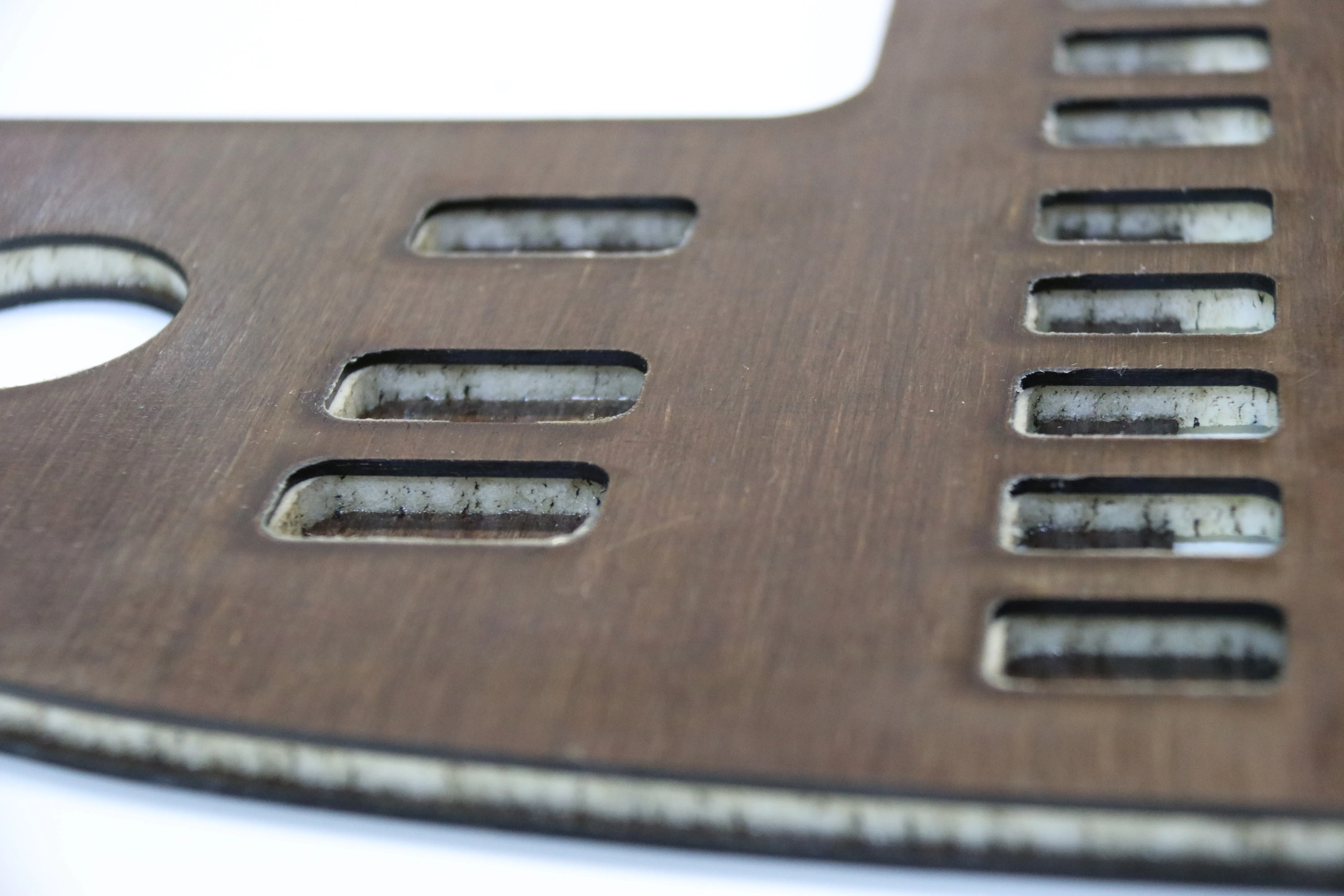 Detail of a cockpit dashboard panel for electric aircraft made from a layered epoxy/hemp panel with an aerospace-grade foam core.