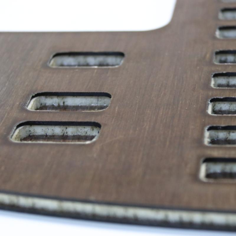 Detail of a cockpit dashboard panel for electric aircraft made from a layered epoxy/hemp panel with an aerospace-grade foam core.